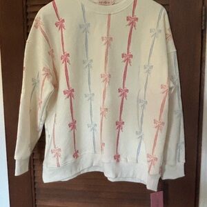 Ivy City Co Cream Sweater with Pink and Blue Bow Design